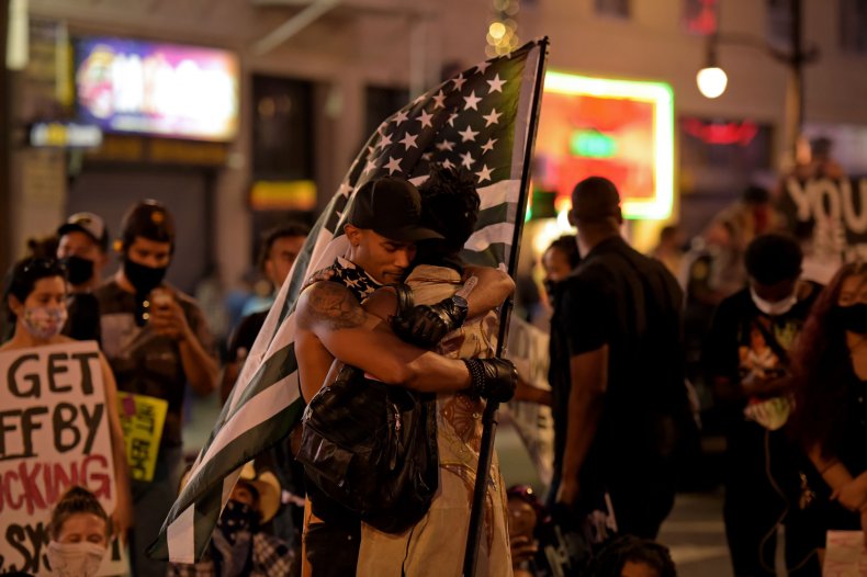 Protesters police brutality hug