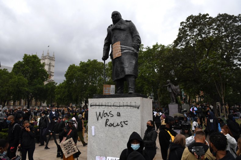 Winston Churchill statue with graffiti