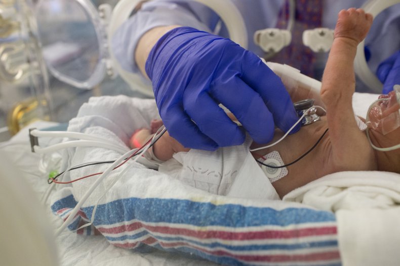 Doctor with newborn baby
