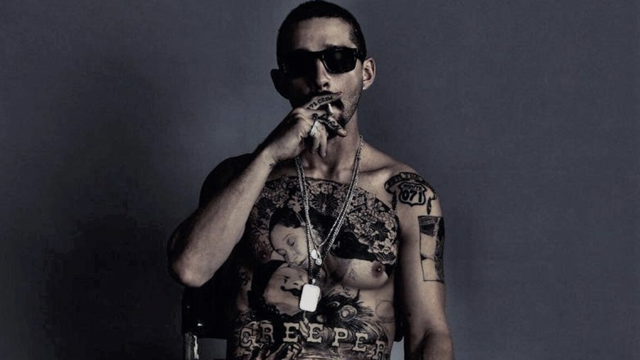 Shia LaBeoufs Tattoo Says CREEPER Across His Stomach and Its Perfect