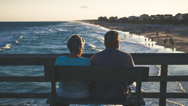 Couple sitting on a bench retirement