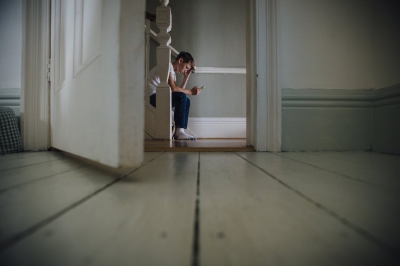 Boy Sits Alone 