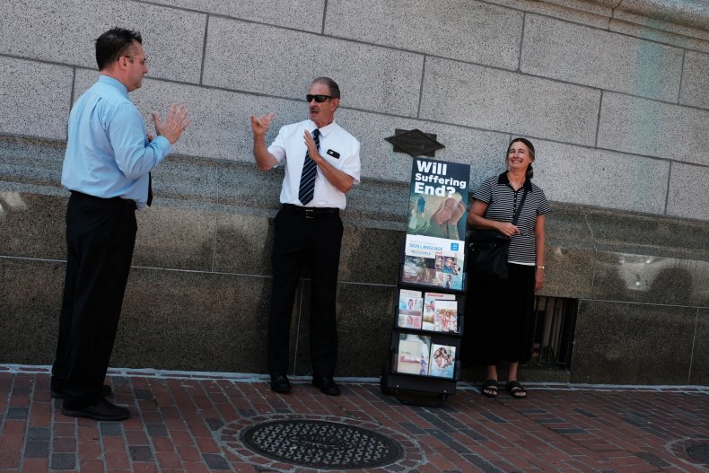 a group of Jehovah's Witnesses stand on