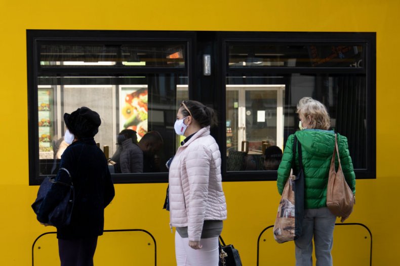 Passengers in line for German bus