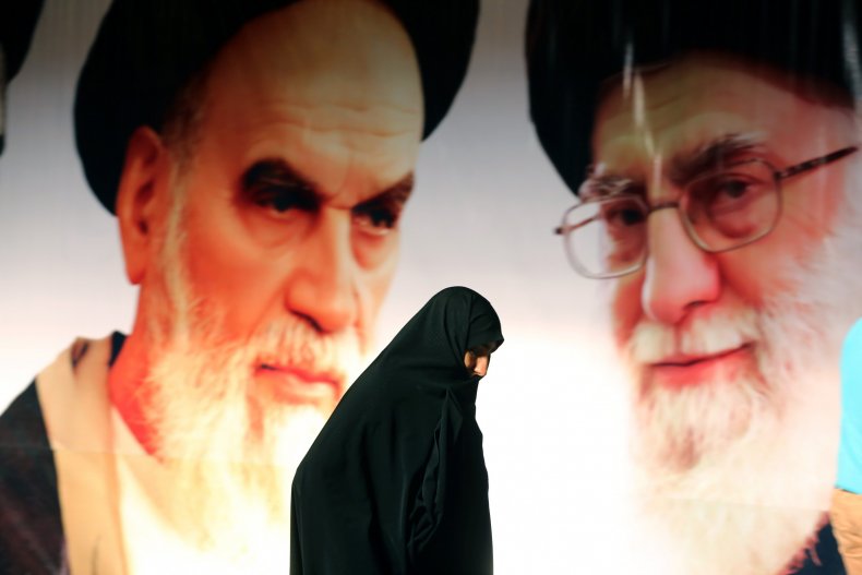 Iranian woman walking in front of ayatollahs