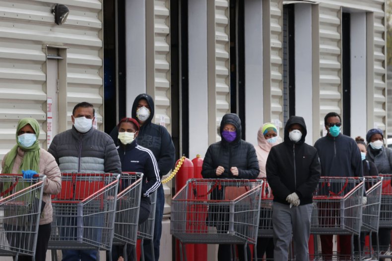 Customers wear face masks while shopping