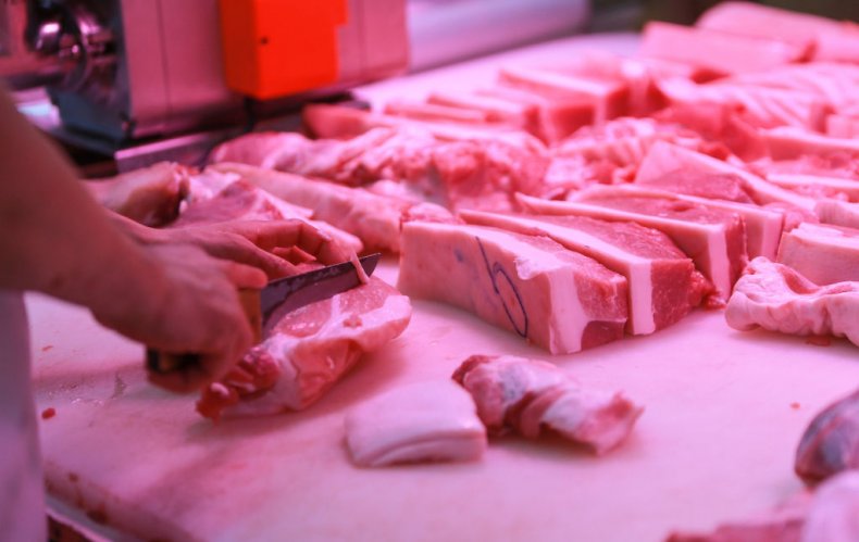 Butcher prepares meat Butcher prepares meat