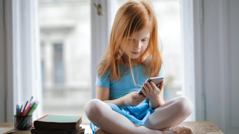 Child holding a phone