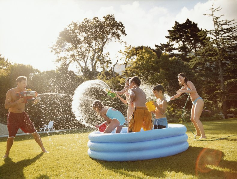 Family playing with water gun