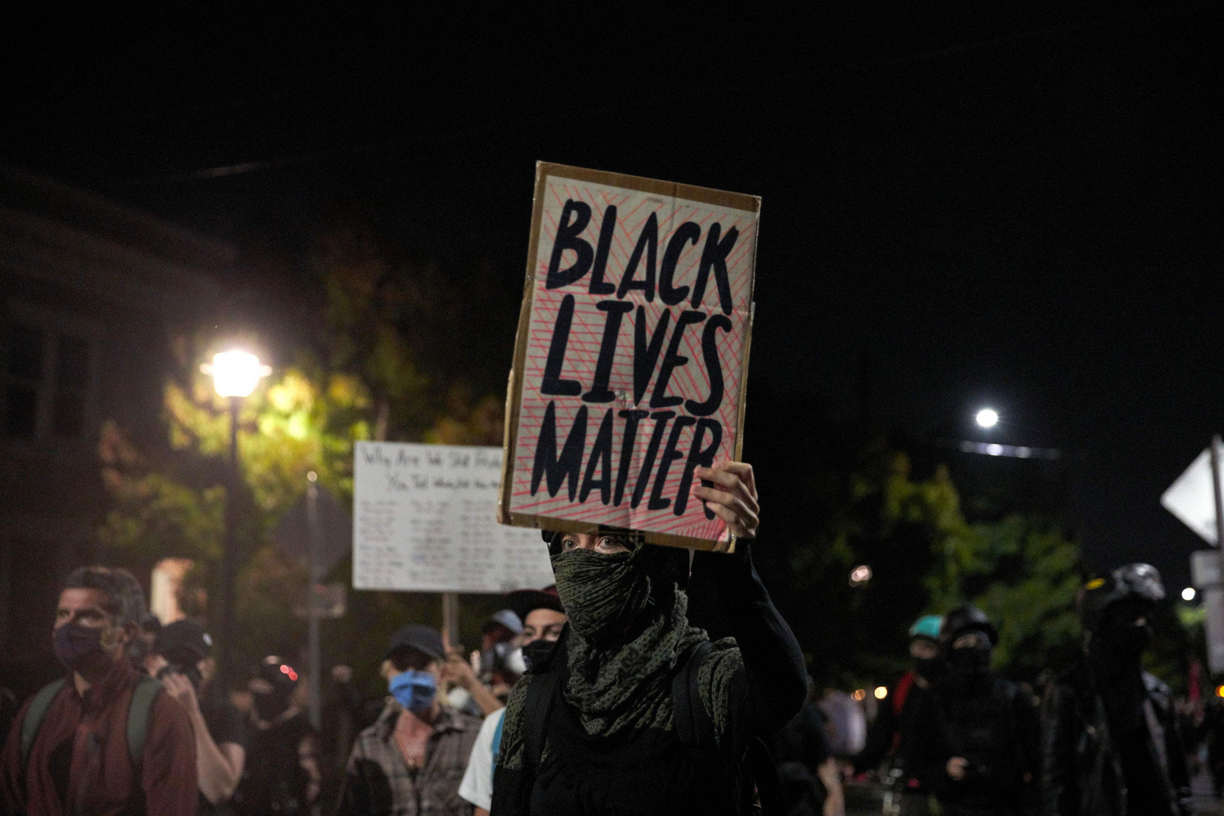 Portland Protester Says 'I Can't Walk' as She Is Carried Away by Police