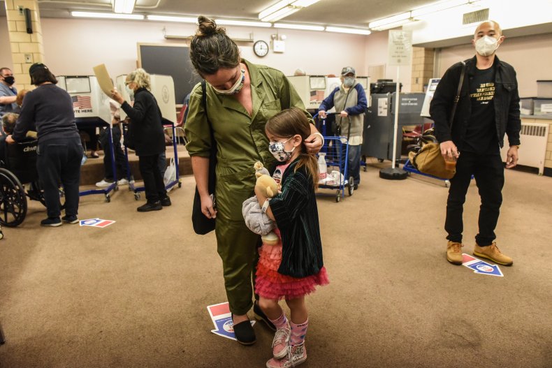 Mother Votes Early With Child