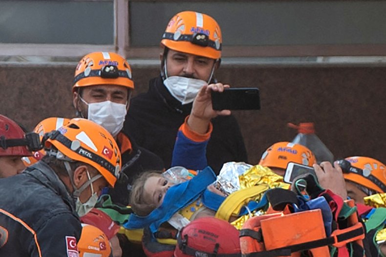 Rescue workers carry Ayda Gezgin in Izmir