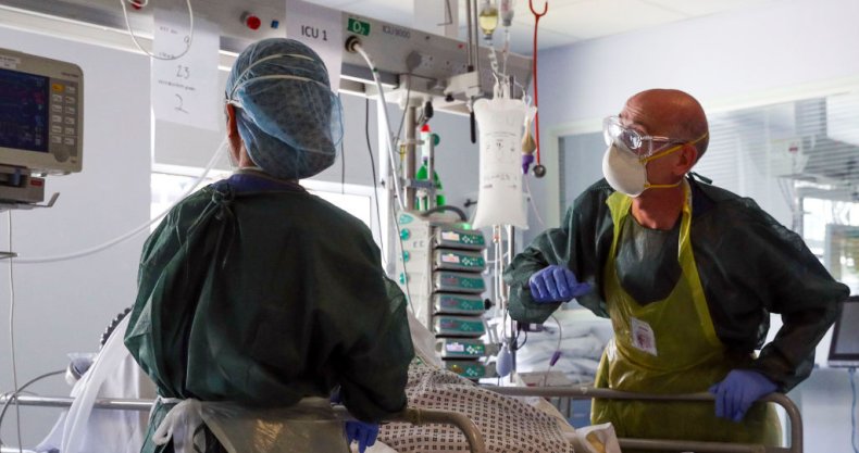 Doctors treat a patient suffering from COVID-19