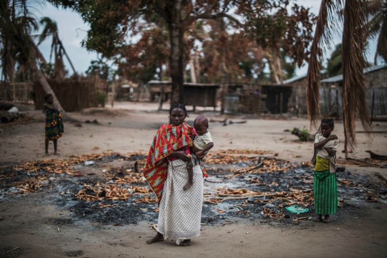 Woman holds baby in Cabo Delgado village