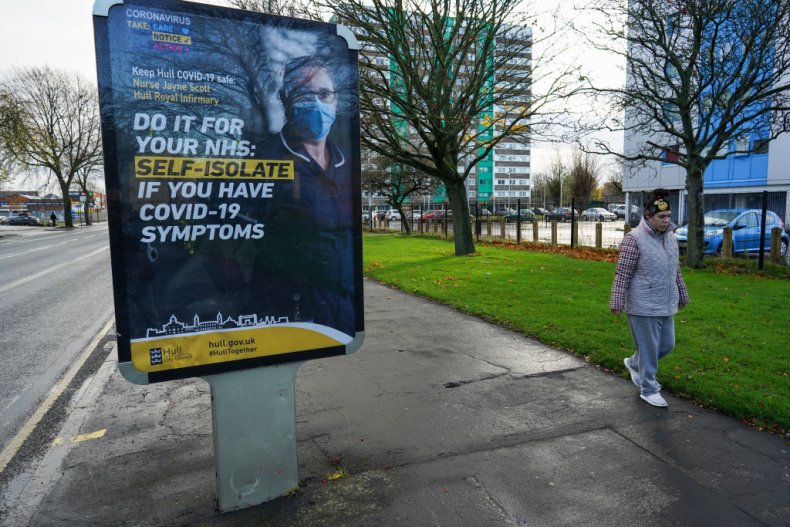 Woman passes COVID sign in Hull