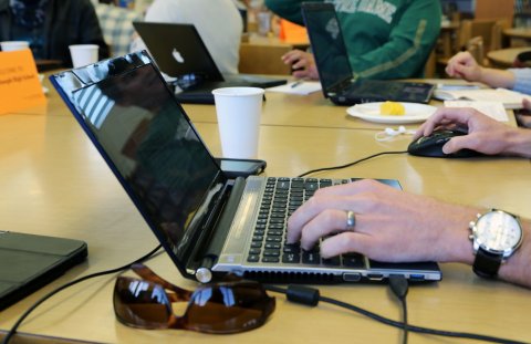 Man with multiple electronic devices