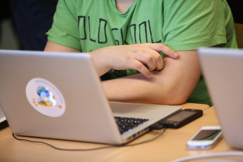 Student accesses computer in Berlin, Germany