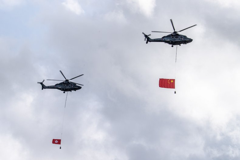 Chinese and Hong Kong Flags Fly