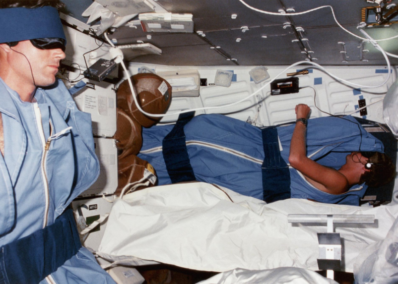 Outer space: Astronauts sleep in restraints