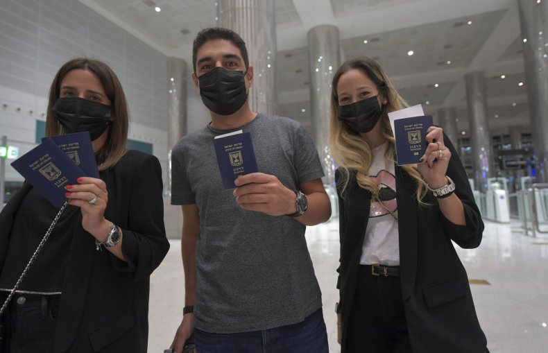 Israelis flash their passports at the Dubai