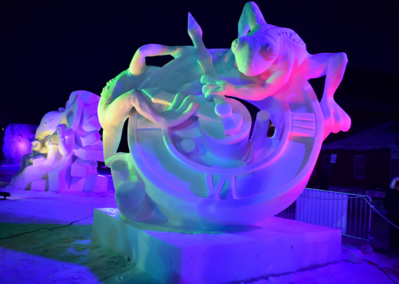 Frogs on a clock snow sculpture in Breckenridge, Colorado