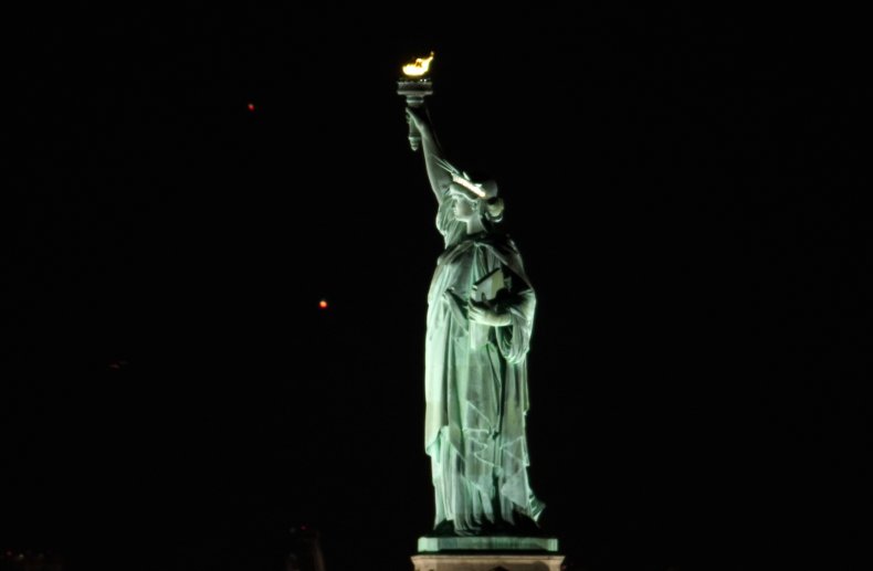 Saturn and Jupiter approach conjunction behind Statue