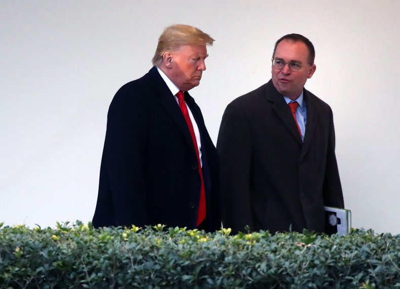 donald trump walks with mick mulvaney