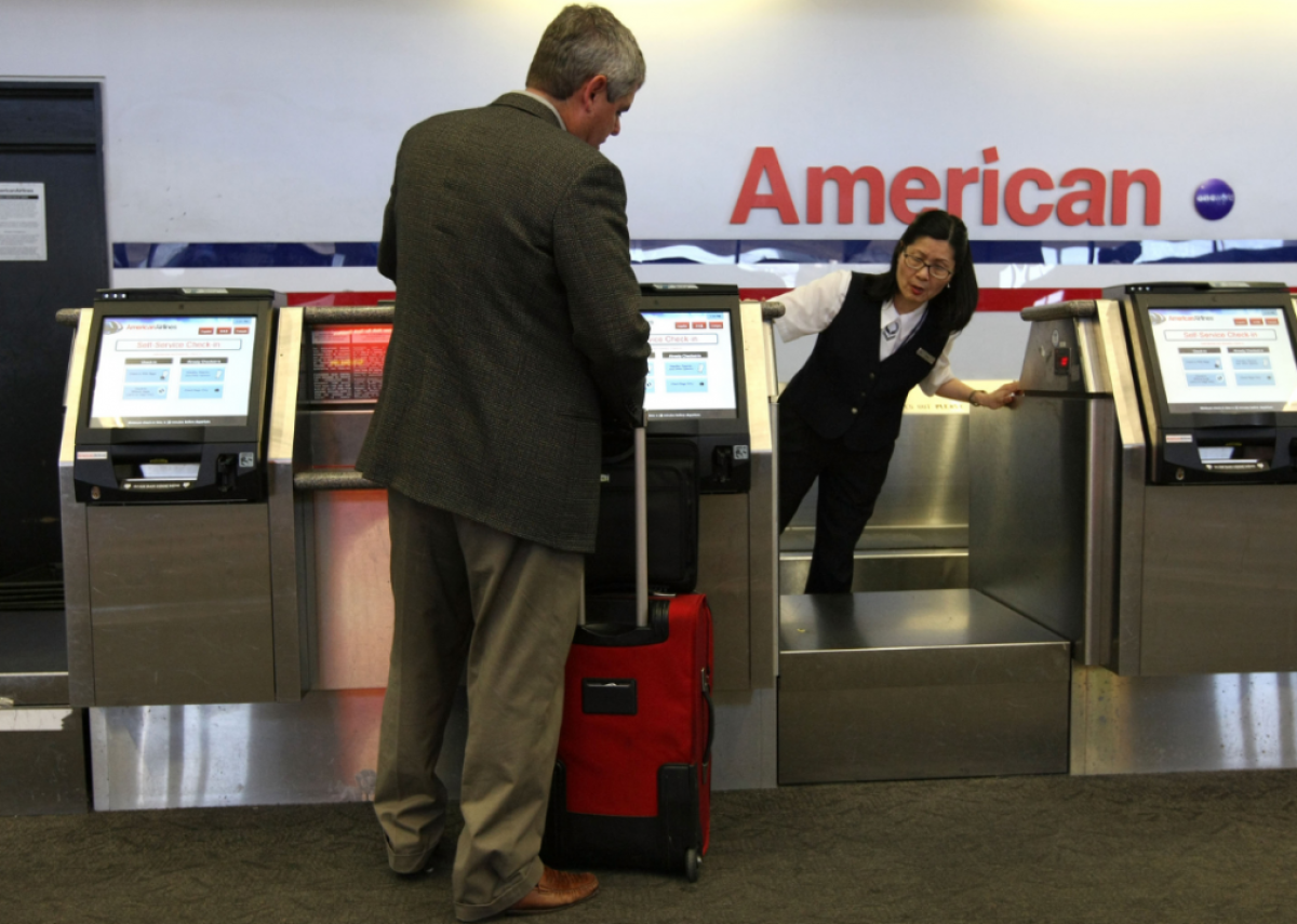 2008: American Airlines starts charging for all checked bags