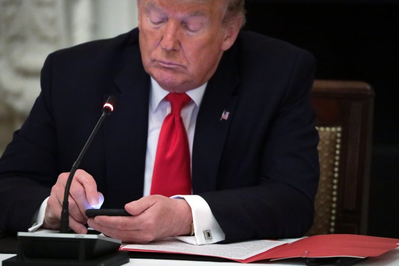 President Donald Trump Works on His Phone