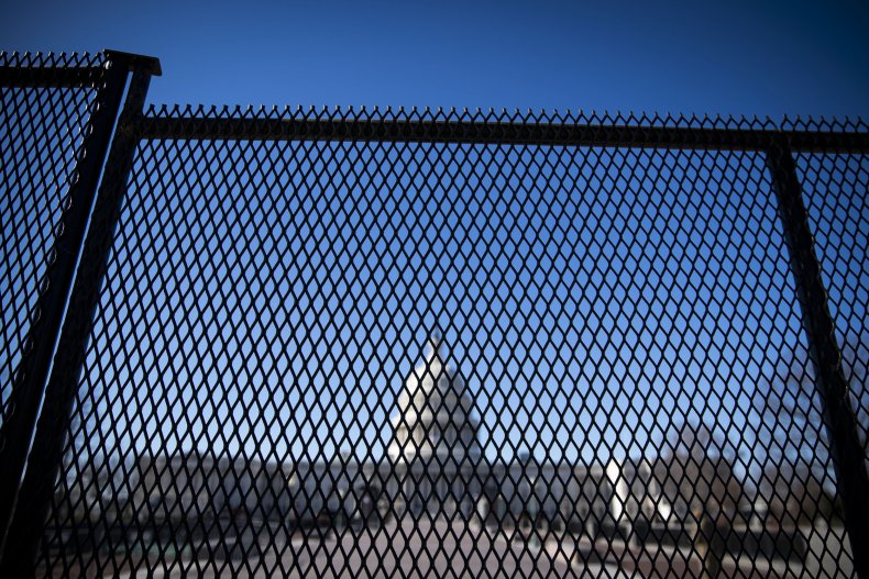 Capitol behind fencing after Trump mob storming