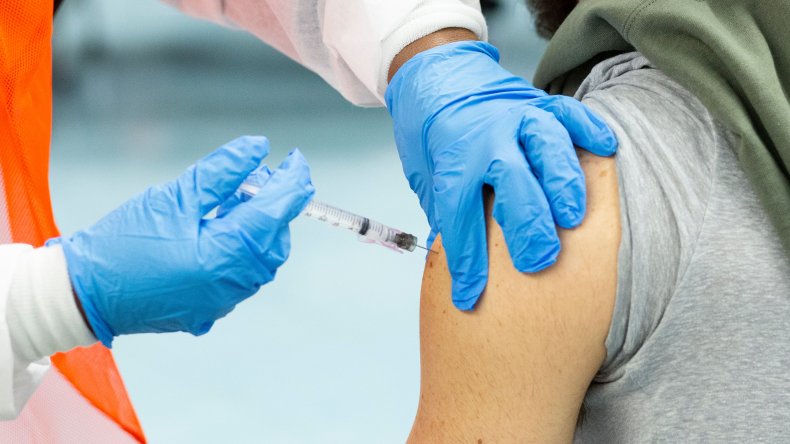 man receives Moderna vaccine