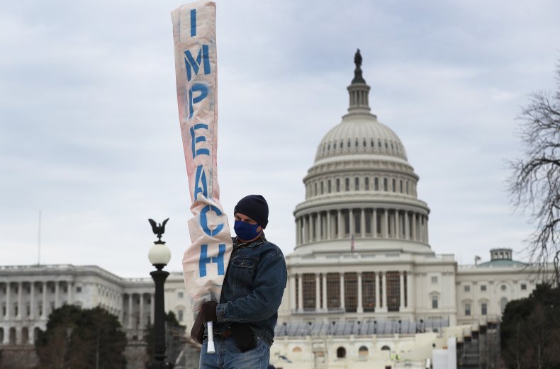impeach sign near U.S. Capitol building