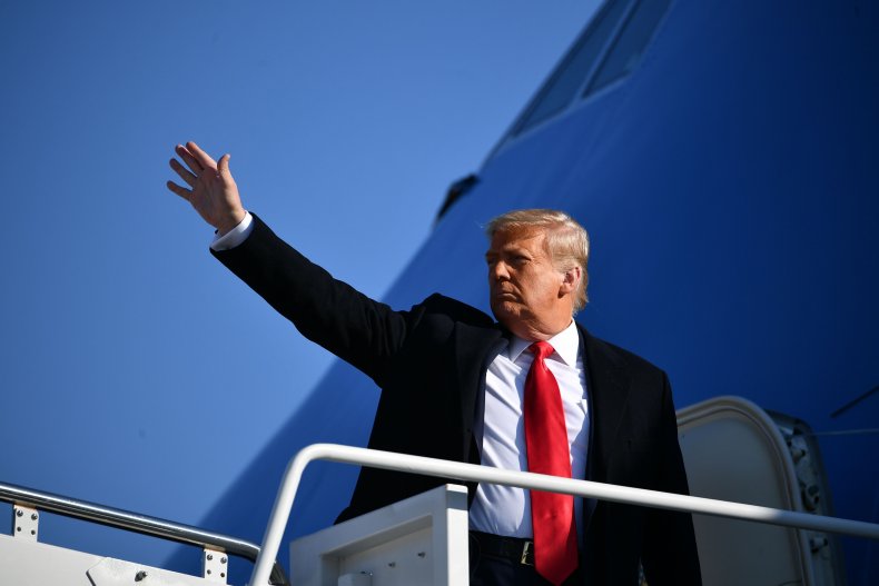 donald trump waves boarding air force one