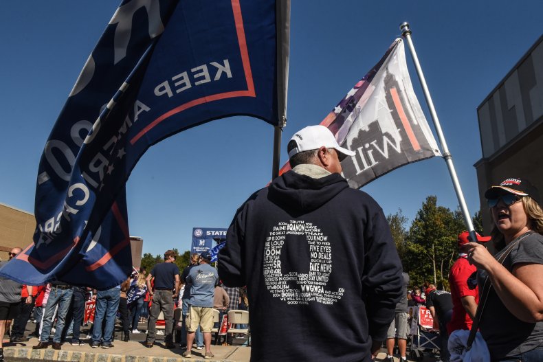 man wears qanon hoodie at trump rally