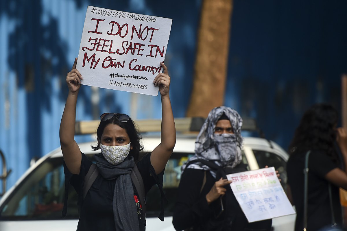 Activists hold placards during a Mumbai protest
