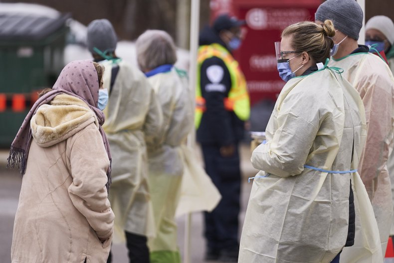 Canadian health workers speak with woman