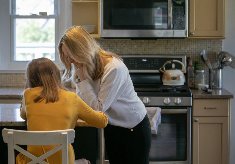 Women and daughter home schooling