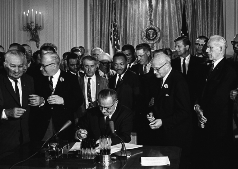 LBJ signs the Civil Rights Act