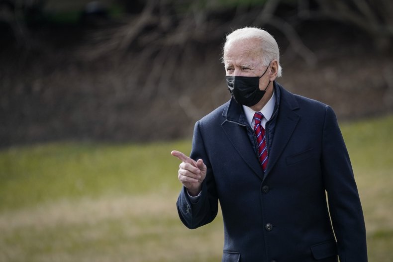 Joe Biden points near the White House