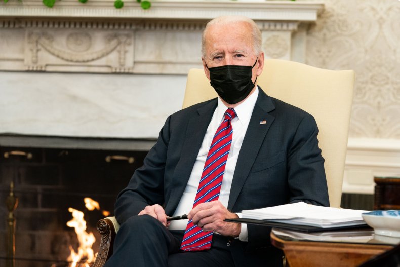 joe biden receiving briefing in oval office
