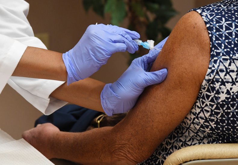 Health worker administers the Moderna COVID-19 vaccine