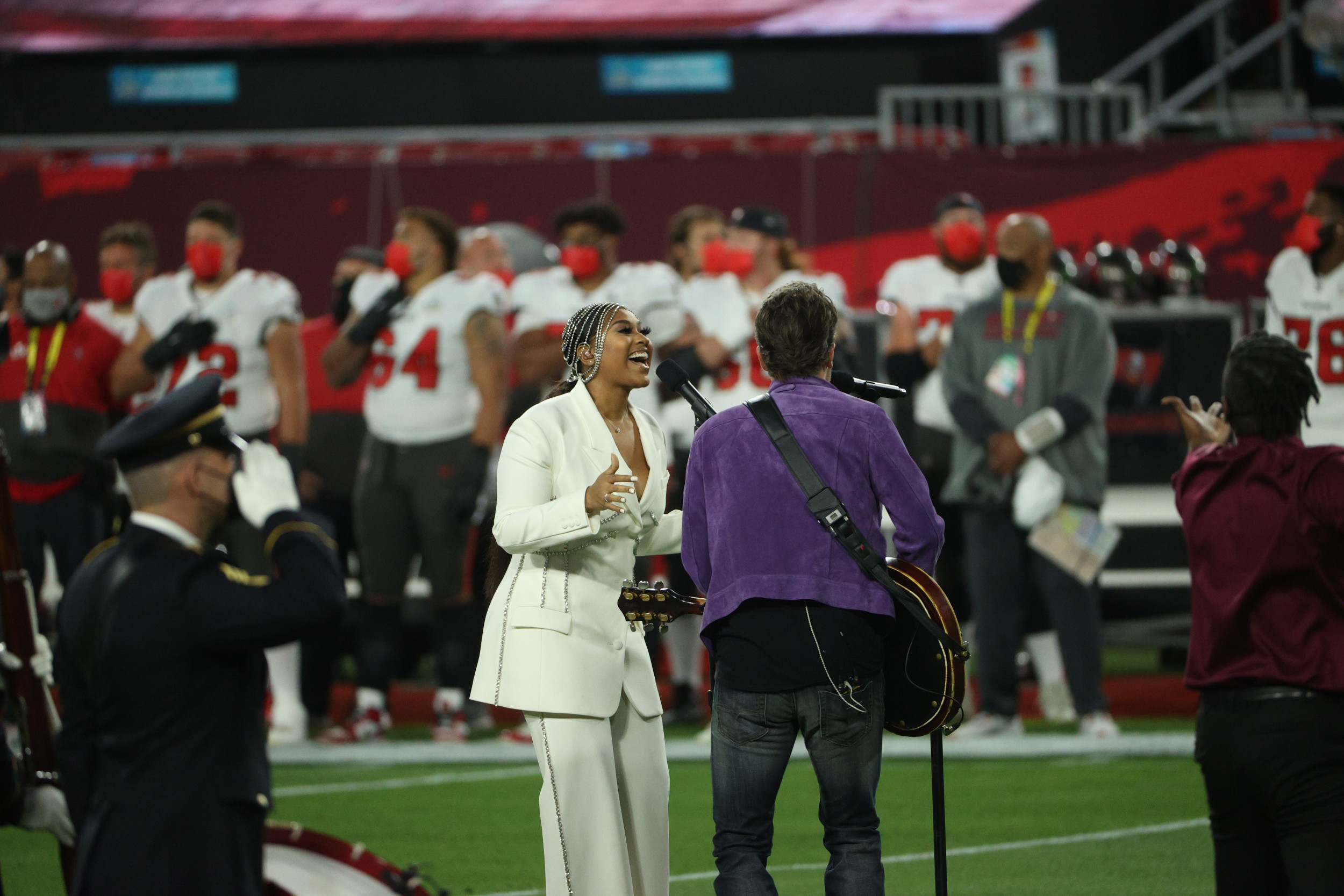 Watch H.E.R. and Jazmine Sullivan perform at the Super Bowl