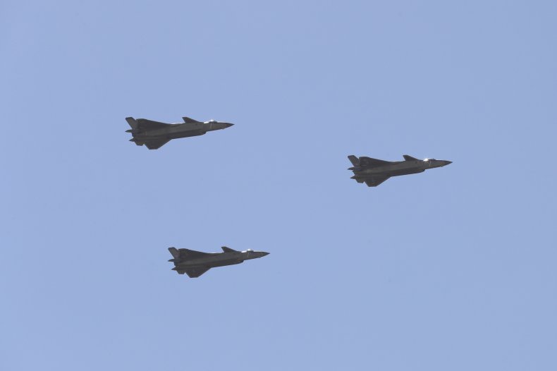 Chinese j-20 jets fly during a parade