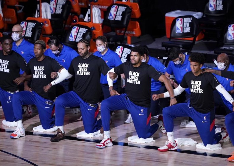 Philadelphia 76ers players kneel and protest