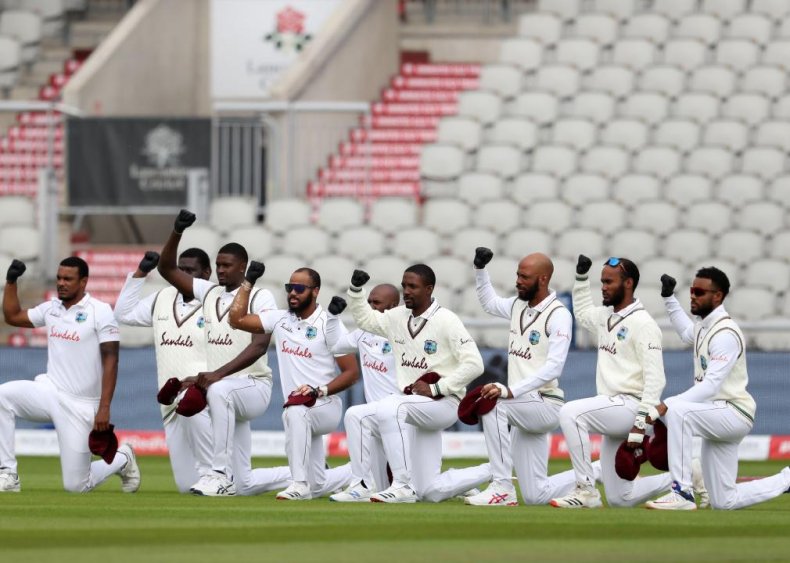 Cricket players take a knee