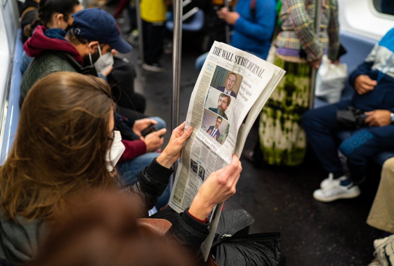 NYC passenger holds The WSJ