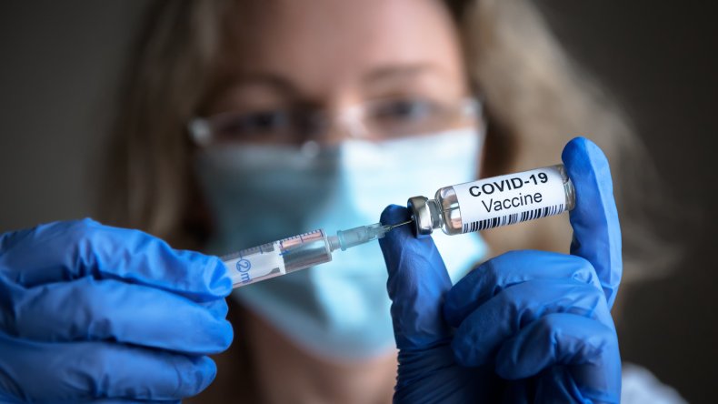Scientist with COVID vaccine