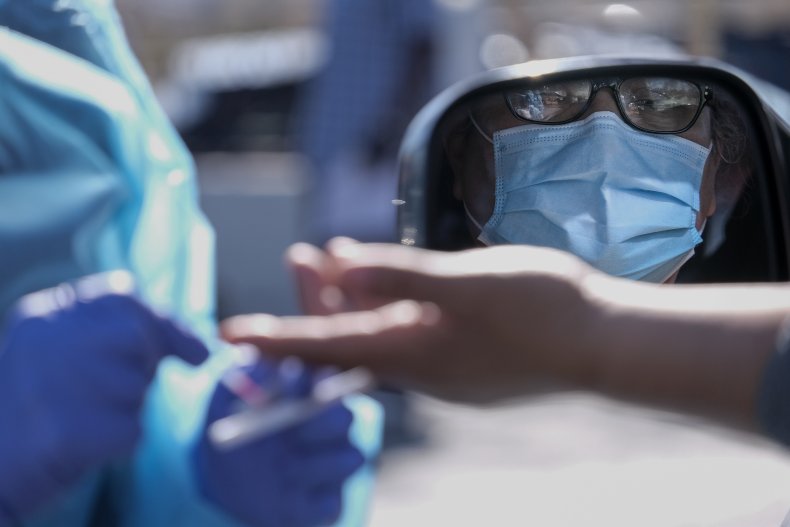 person in mask at testing site california
