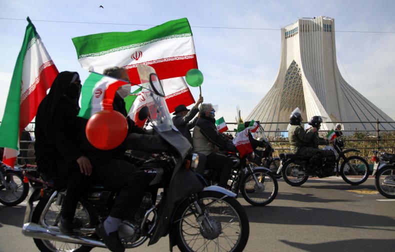 Iranians pictured in Tehran celebrating national day