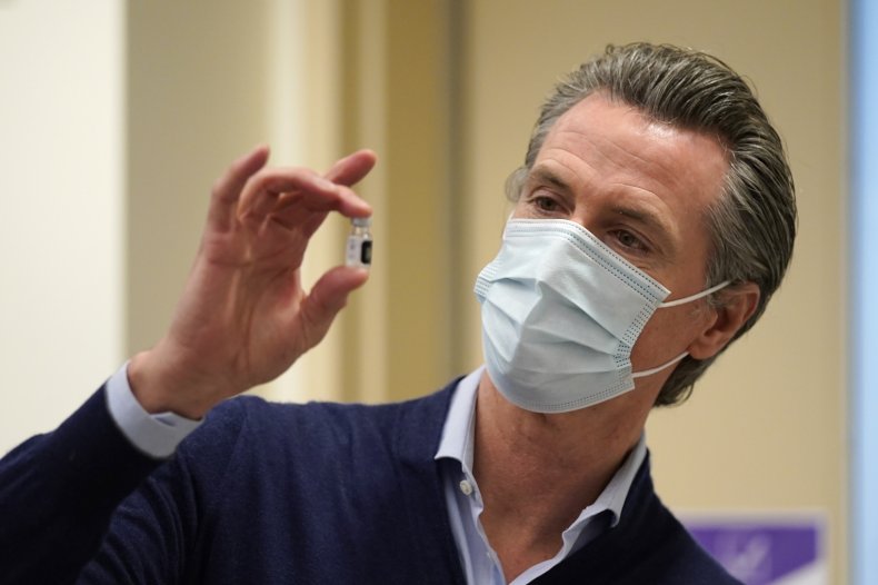 Gavin Newsom Holds a Vial of Vaccine